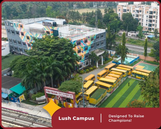 Lush campus of Orchids Mahalakshmi Layout, a top CBSE school in Bangalore, with expansive grounds and modern facilities.